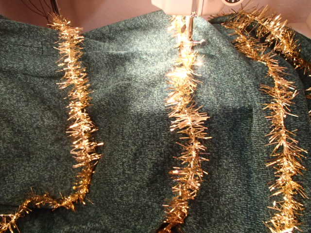 Zig-zag stitching the garland down onto the sweater